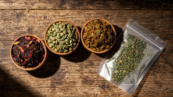 Four coffee processing types side by side: natural, washed, honey, and anaerobic green beans